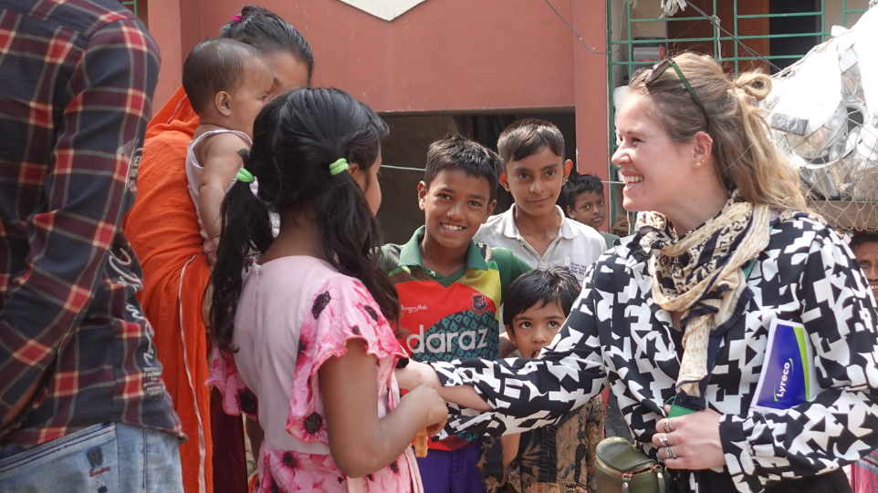 Marloes Philippo engaging apparel workers and children in a community in Bangladesh. Photo credit: GoodWeave International