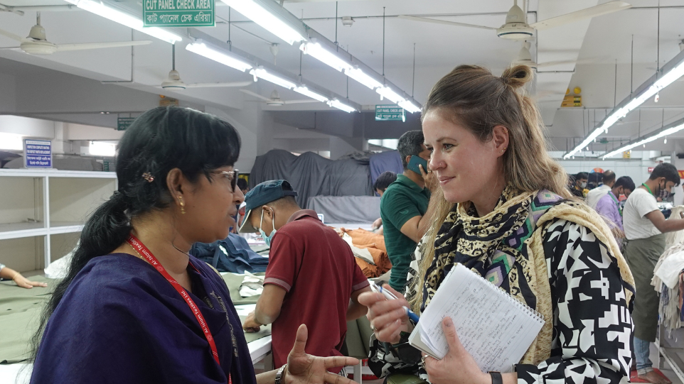 Ms. Philippo speaking with a welfare officer at an apparel factory in Bangladesh. Photo credit: GoodWeave International